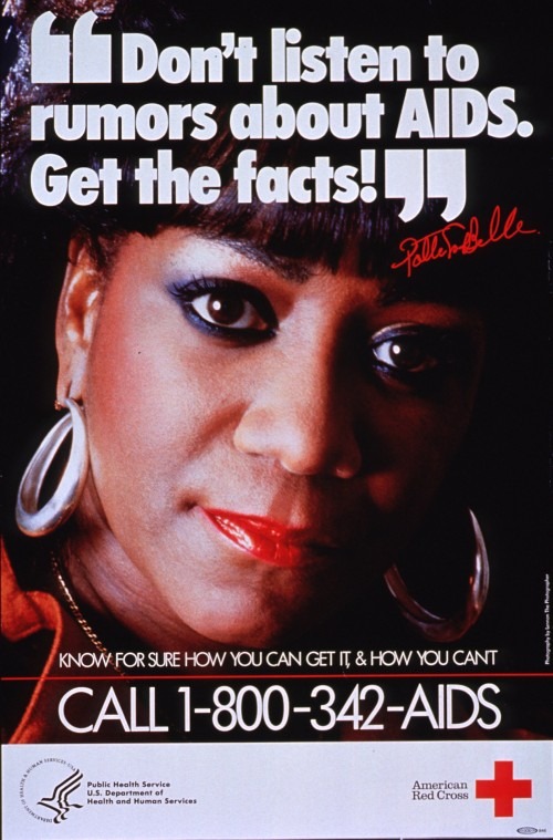 Poster urging people to call the Red Cross for the facts about AIDS. Singer Patti LaBelle, a Black woman wearing large silver hoop earrings looks directly at the camera.